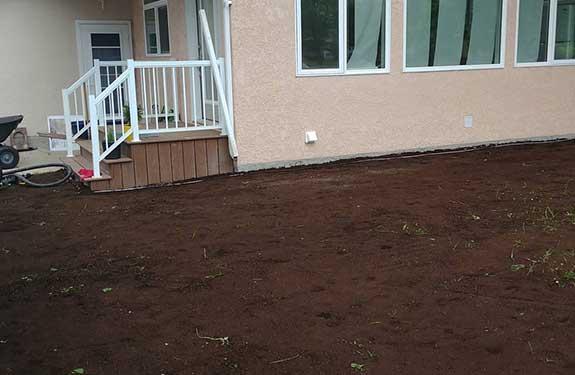 Front lawn of freshly laid soil